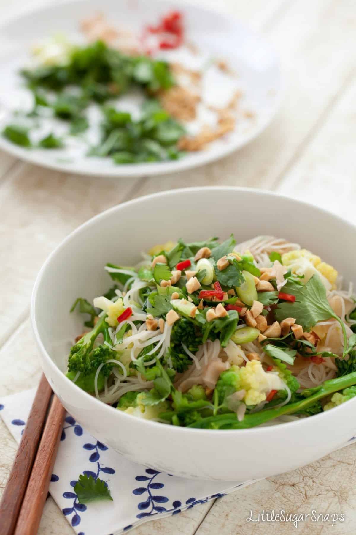Pickled Ginger Noodle Salad topped with coriander and peanuts