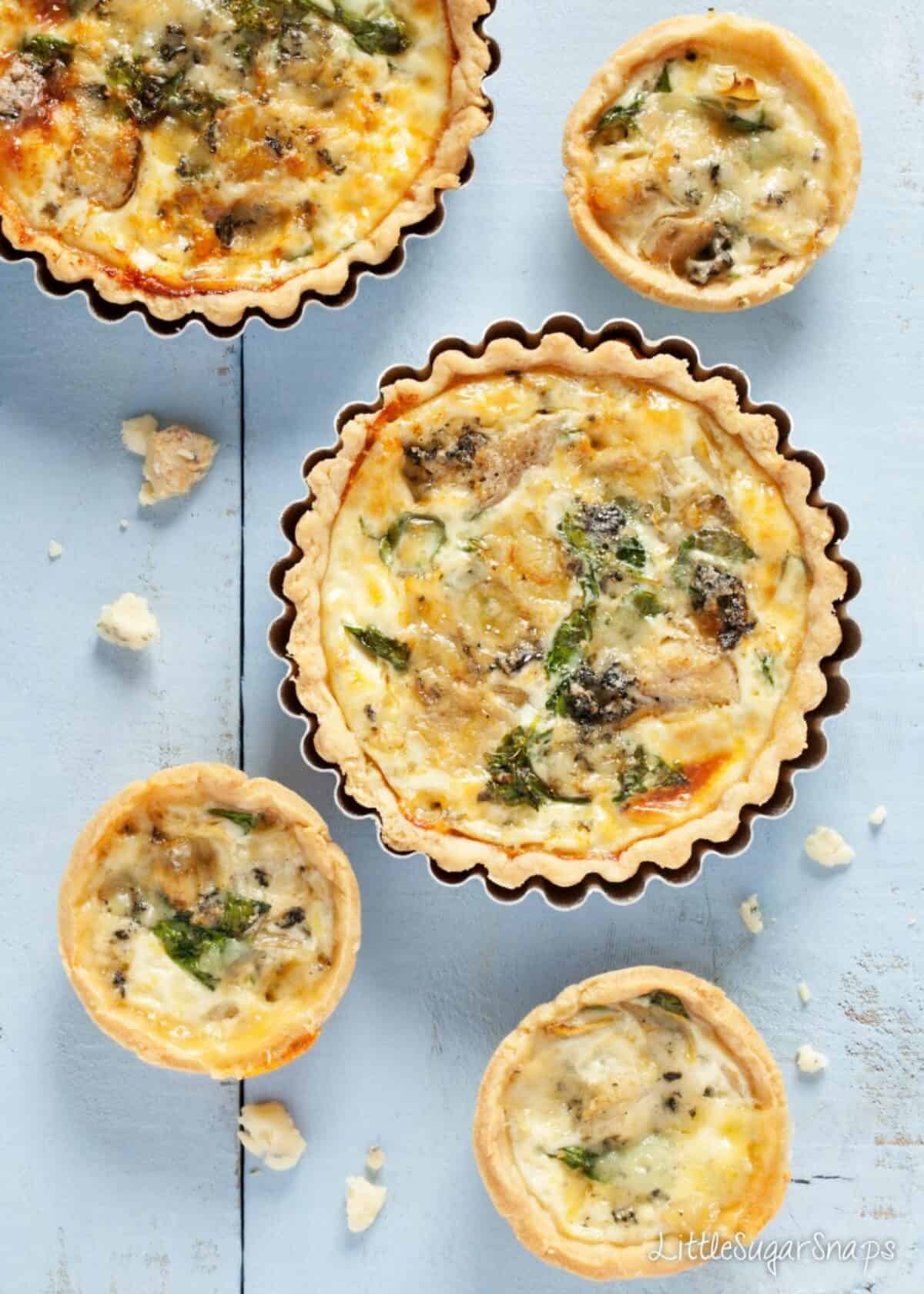 Blue Cheese watercress artichoke tarts Blue Cheese, watercress & artichoke tarts of various sizes