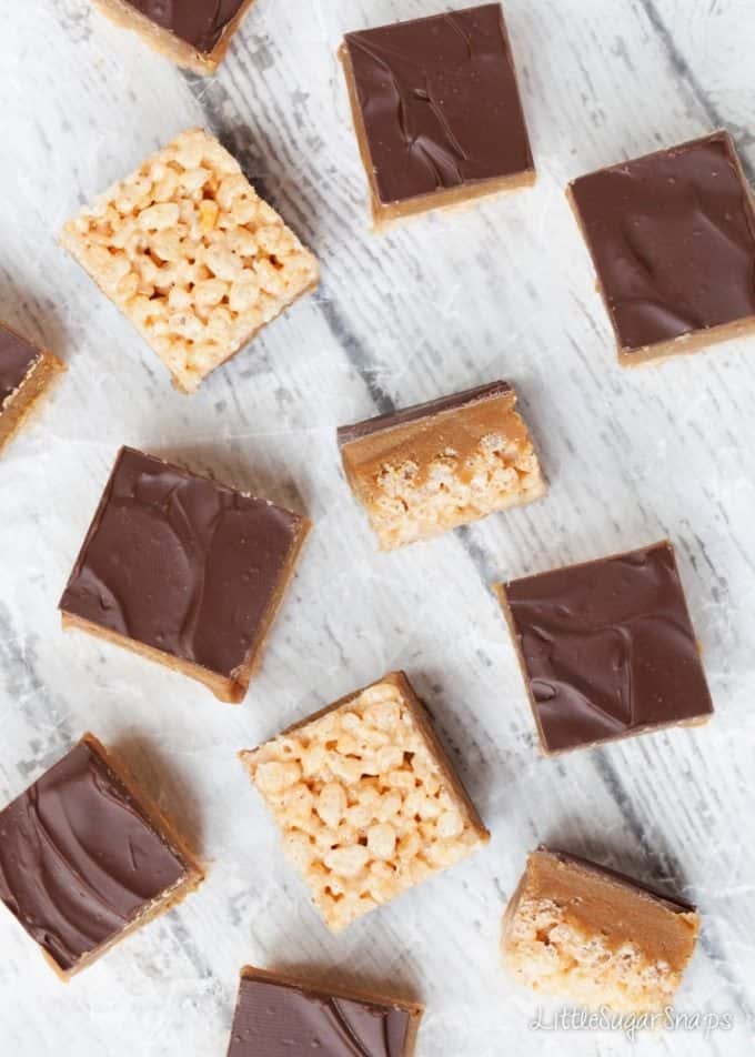 Chunks of Millionaire's chocolate Caramel rice Krispie treats on wax paper