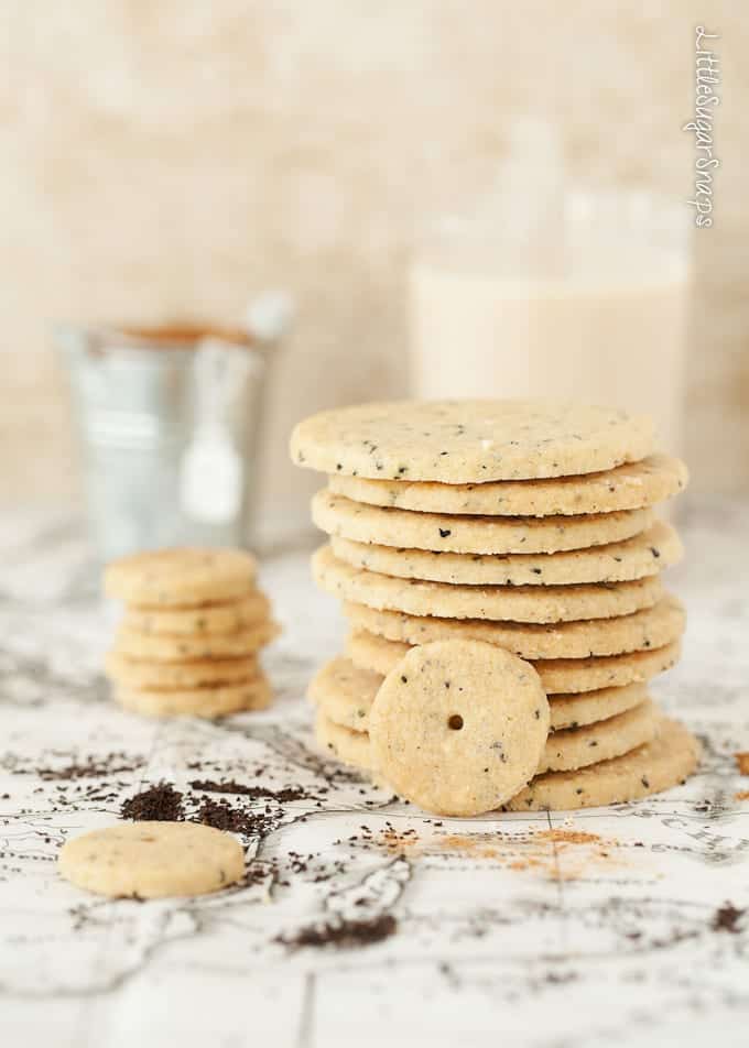 A stack of chai shortbread cookies with flecks of black tea in them.
