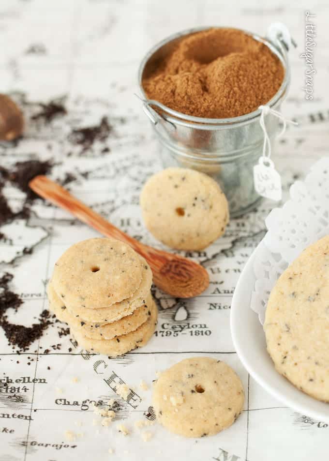 A stack of mini chai spiced cookies with flecks of black tea in them. 