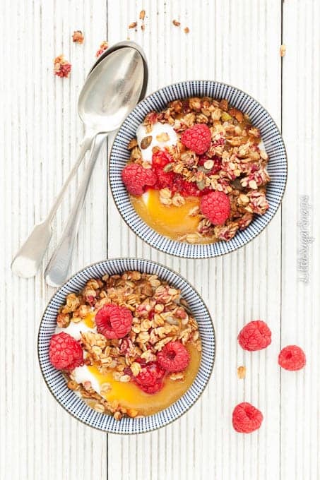Peach puree, raspberry granola and fresh raspberries with yoghurt