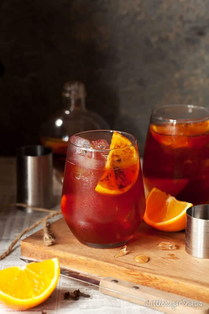 Negroni cocktails garnished with charred orange wedges
