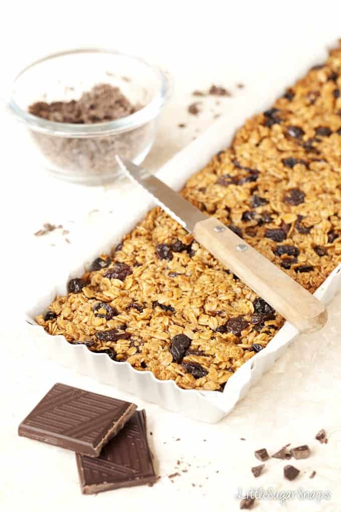 Flapjack with raisins in a baking tin baked and ready to cut