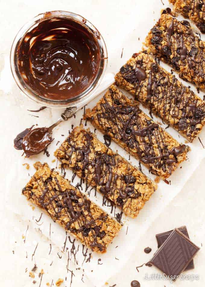 Brown sugar Flapjacks being drizzled with melted chocolate