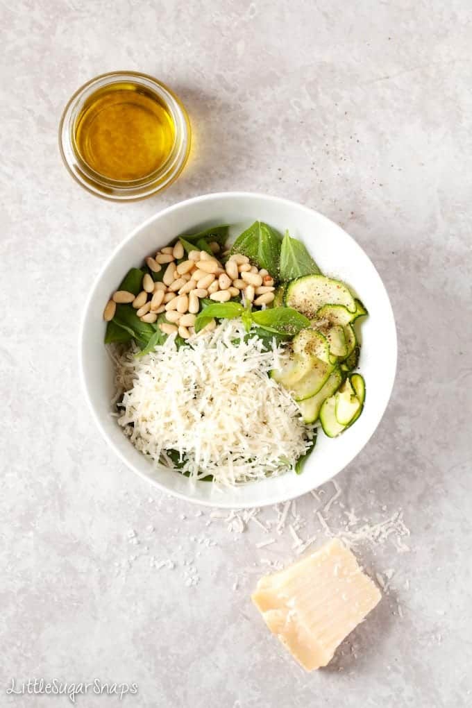 Ingredients for Zucchini Basil Salad in a bowl before being tossed together.