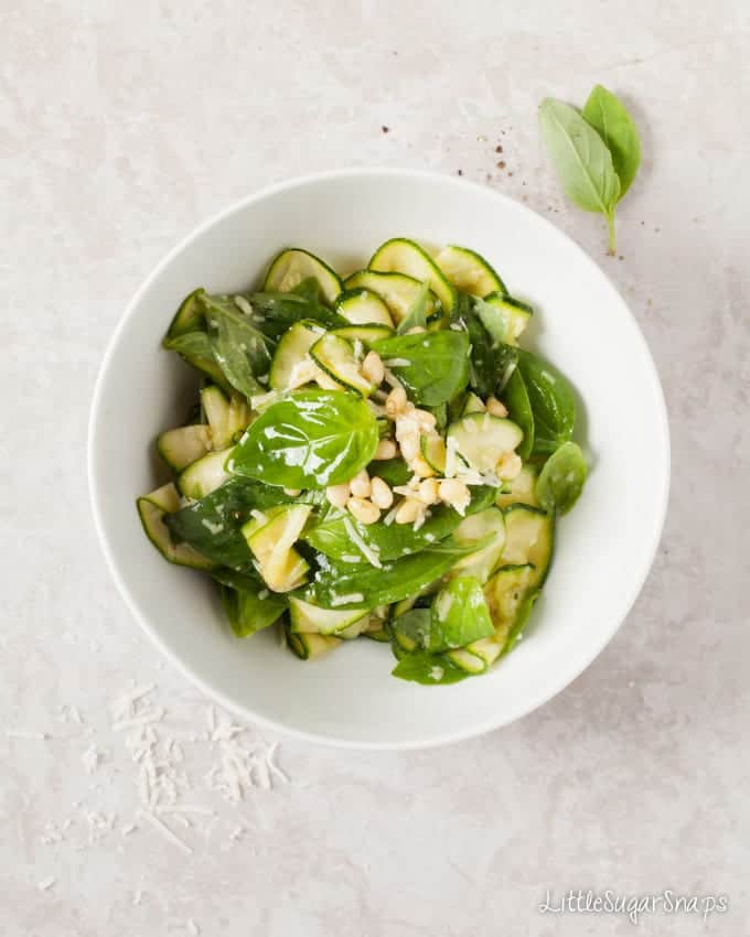 A bowl of Zucchini & Basil Salad with parmesan and pine nuts