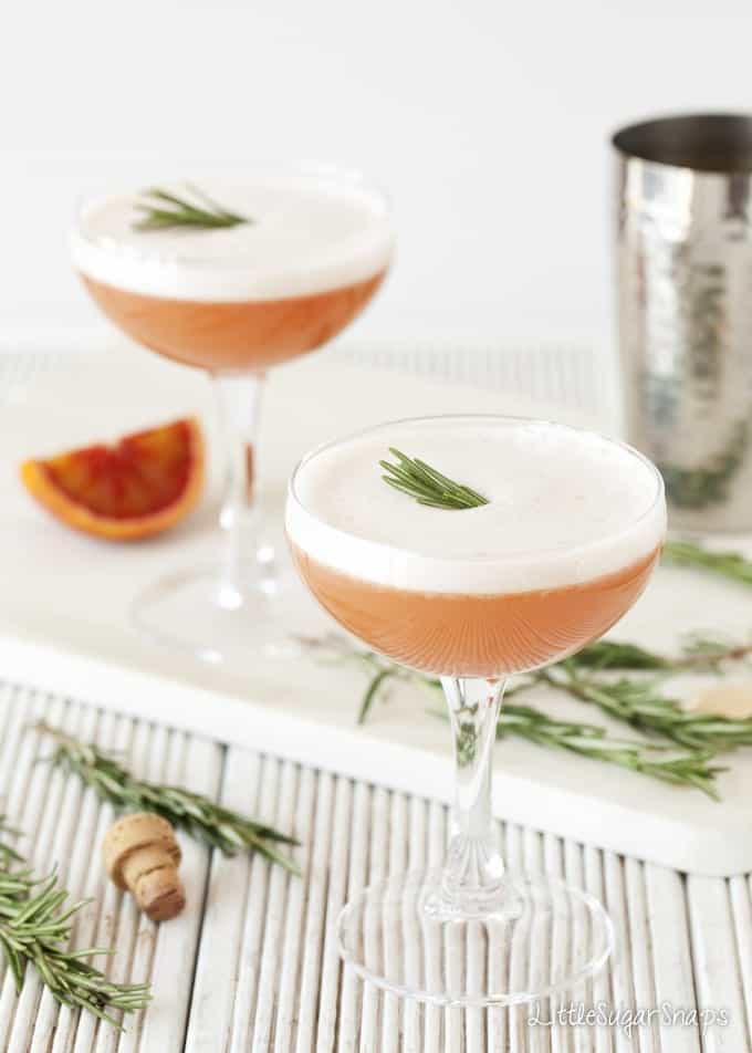 Blood Orange Martini with egg white foam in a cocktail glass