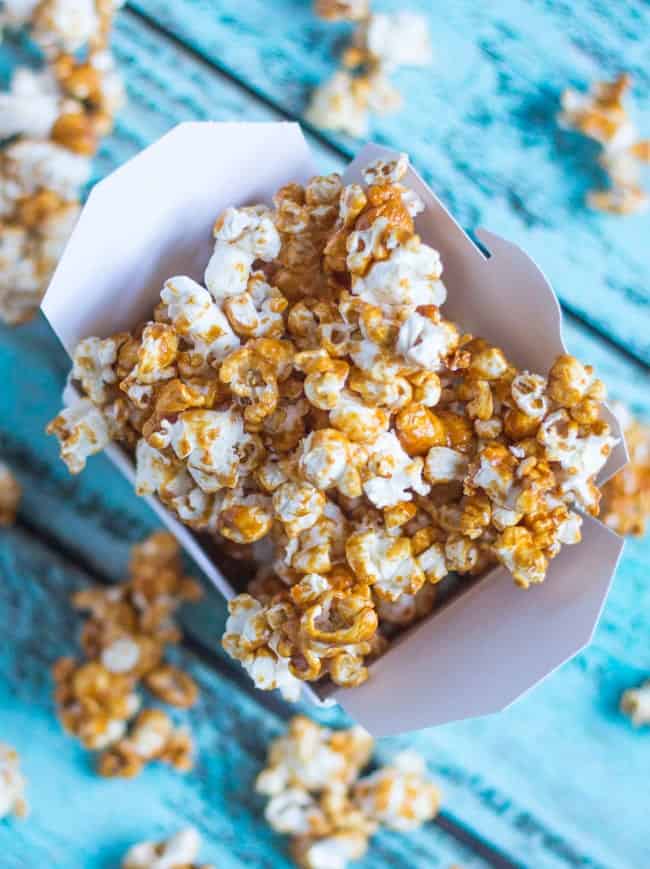 Coconut Maple Caramel Popcorn in a cardboard box