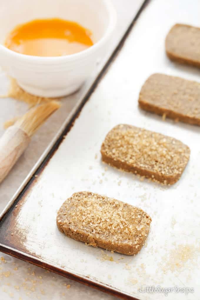 Ginger Spiced Rye Biscuits topped with demerara sugar on a baking sheet