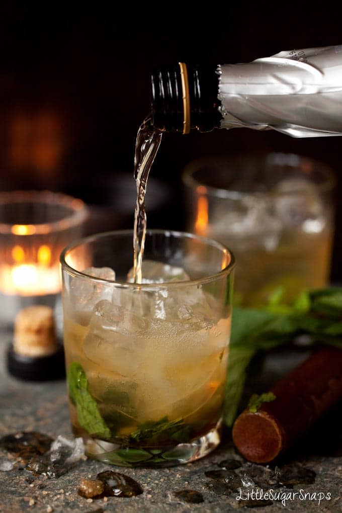 Whisky Ginger Julep being topped with prosecco