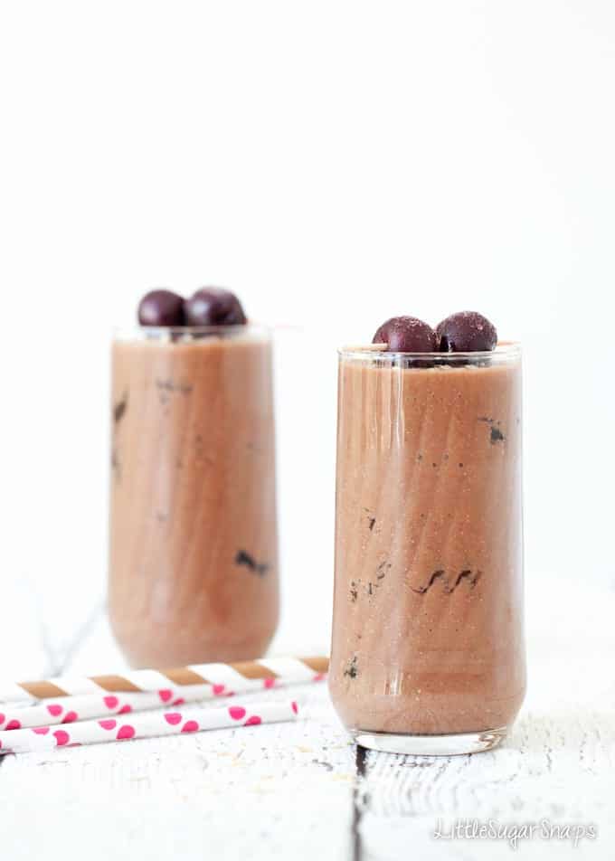 Skinny Chocolate Cherry Coconut Shake Two glasses of chocolate milkshake topped with cherries