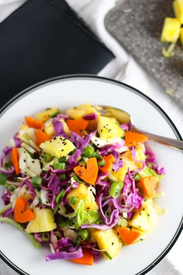 A plate of Hawaiian Slaw with red cabbage and pineapple