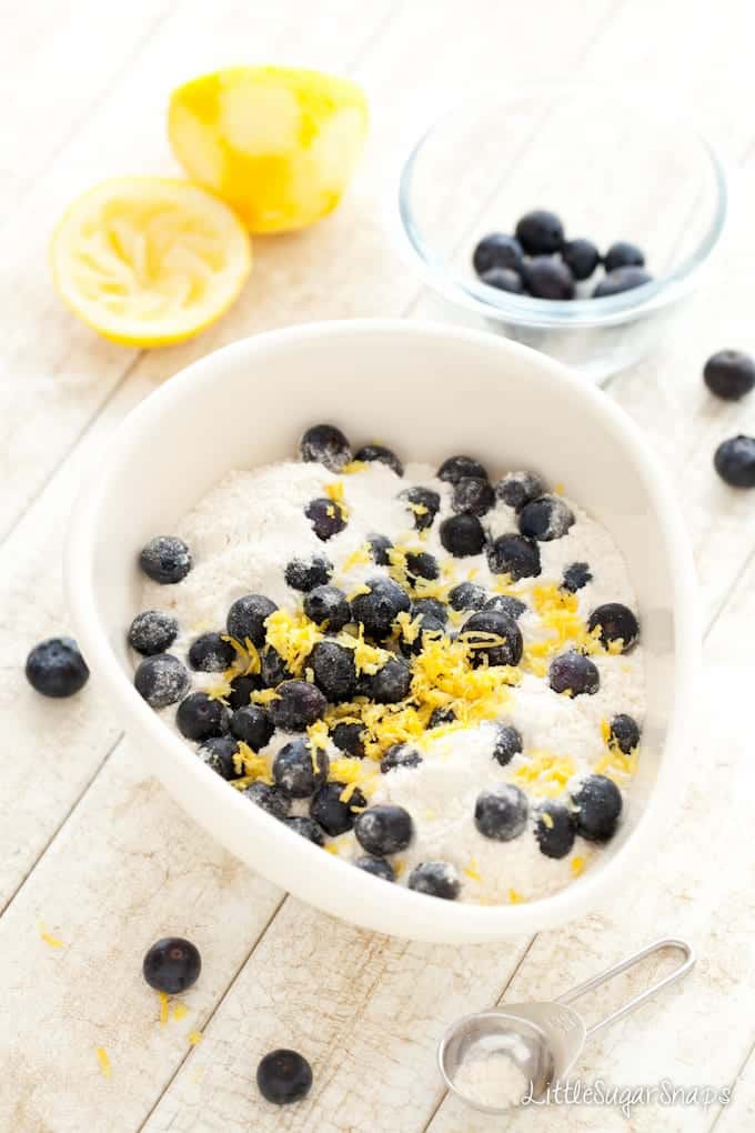 Ingredients for making blueberry and lemon scones in a mixing bowl