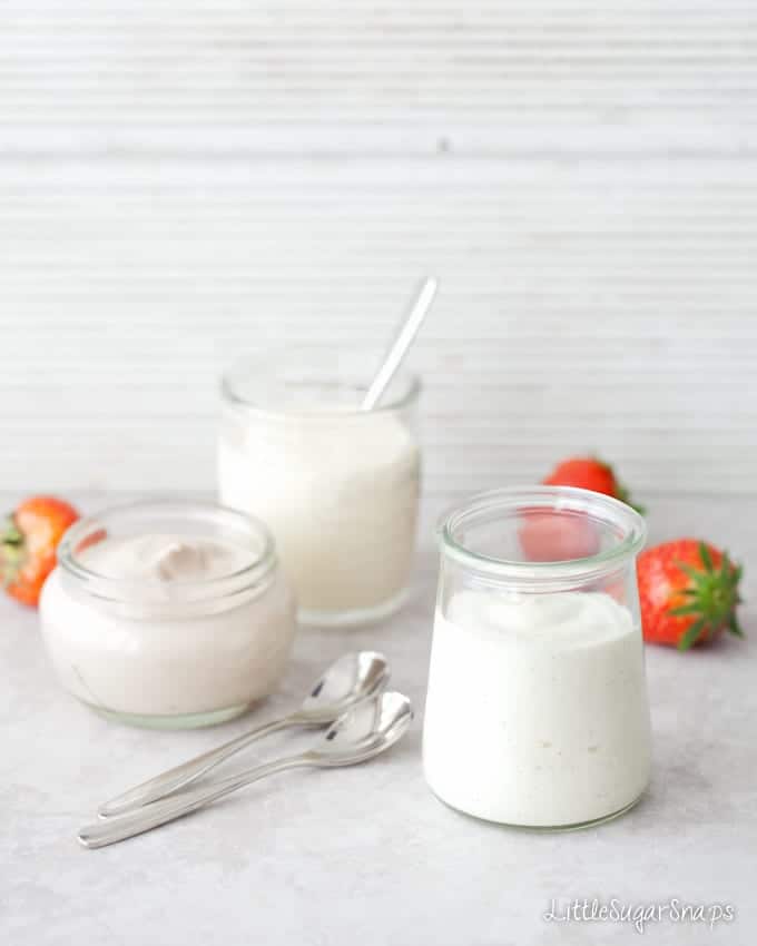 Homemade flavoured yoghurt in small glass pots