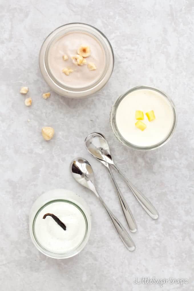 Pots of Reduced sugar yoghurt flavoured with vanilla, mango and hazelnuts