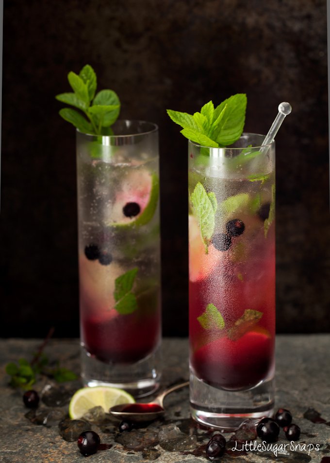 Blackcurrant Mojitos in tall slim glasses