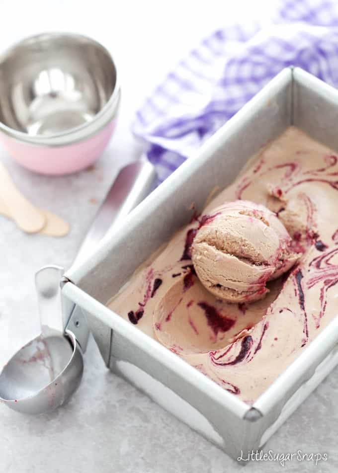 Nutella Ice Cream with blackberry ripple in a metal tin.