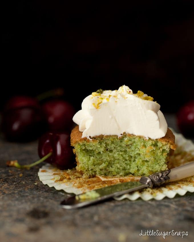 Cut open pistachio cupcake revealing a green sponge.