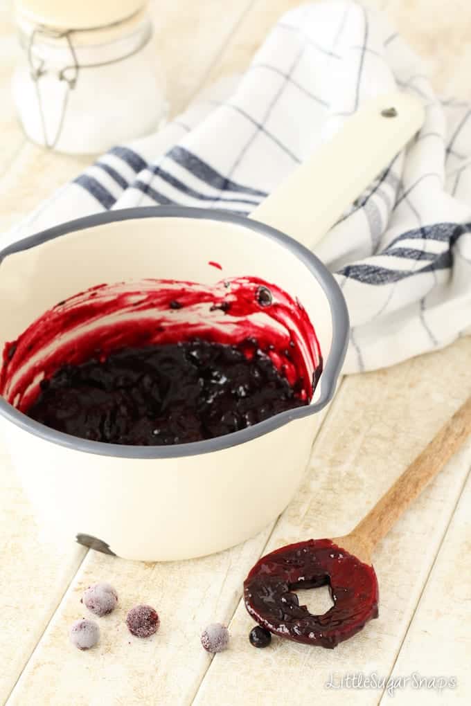 Blackcurrant pie filling in a pan.