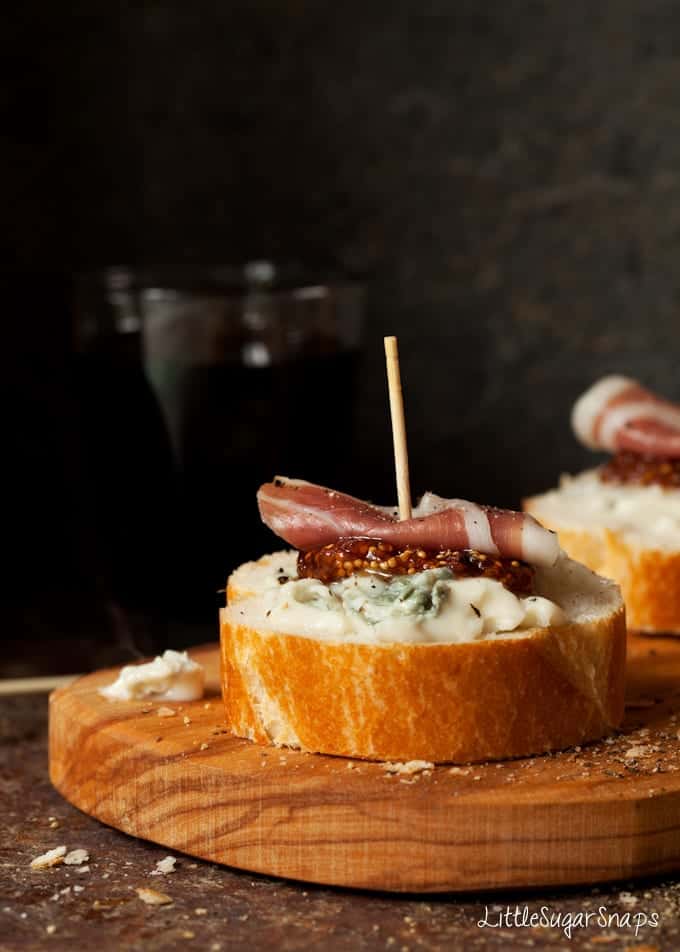 Close up of a Gorgonzola Crostini with fig and prosciutto.