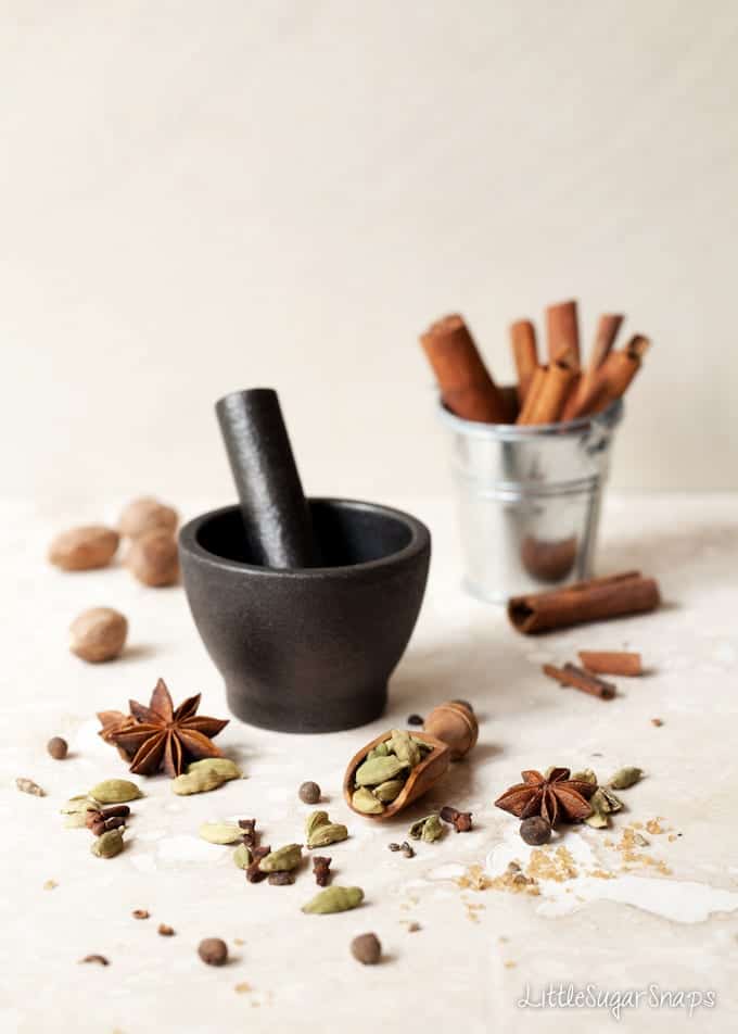 Cinnamon, cardamon, nutmeg, star anise and a pestle & mortar