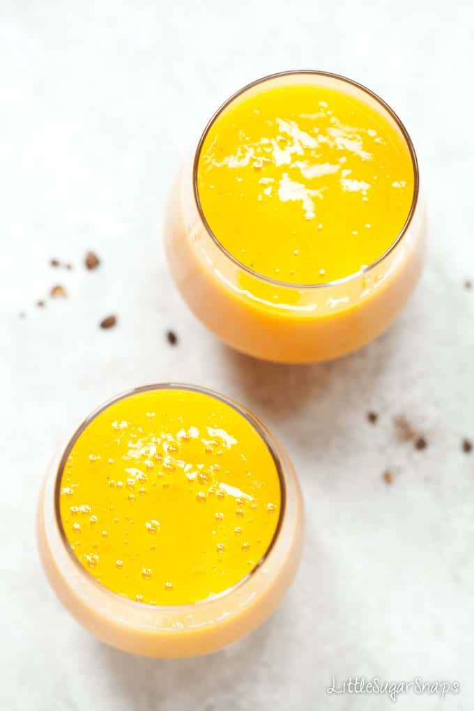 Overhead view of Turmeric Smoothie made with tropical fruits.