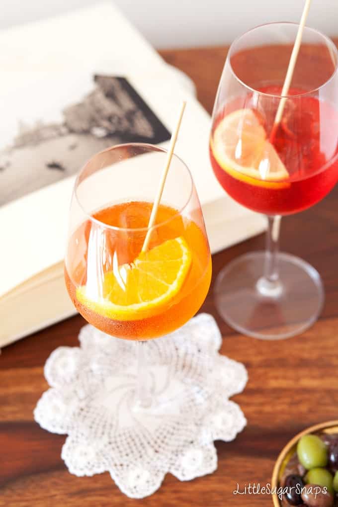 Aperol Spritz and campari spritz in glasses.