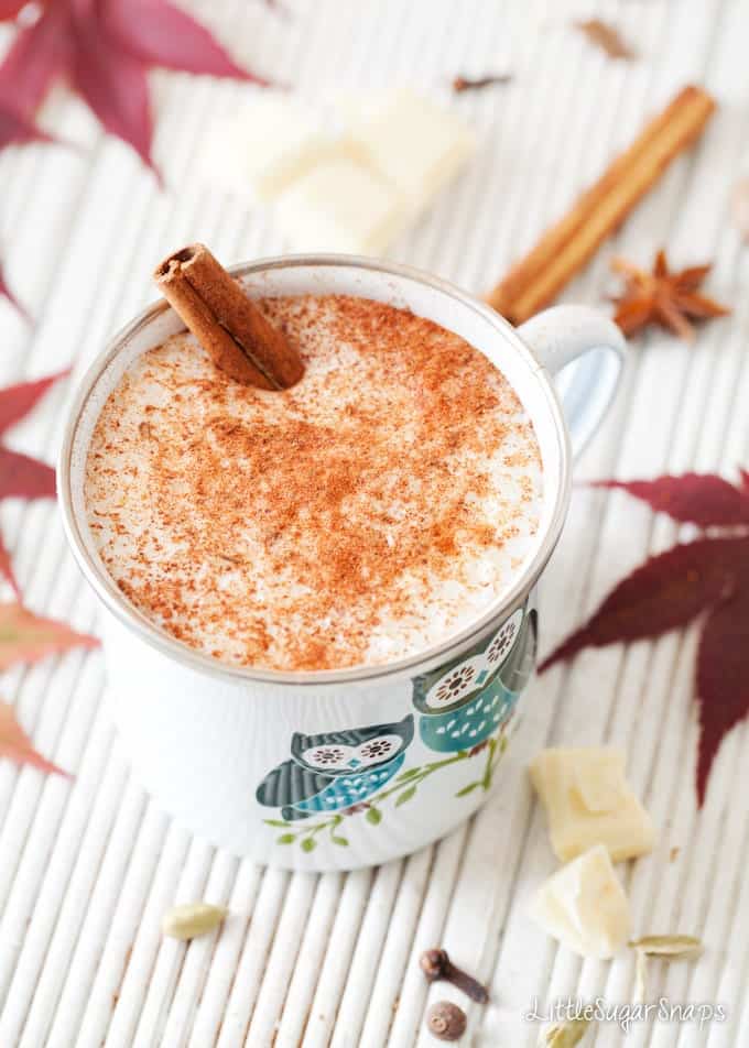 White Hot Chocolate in an enamel mug topped with ground spice