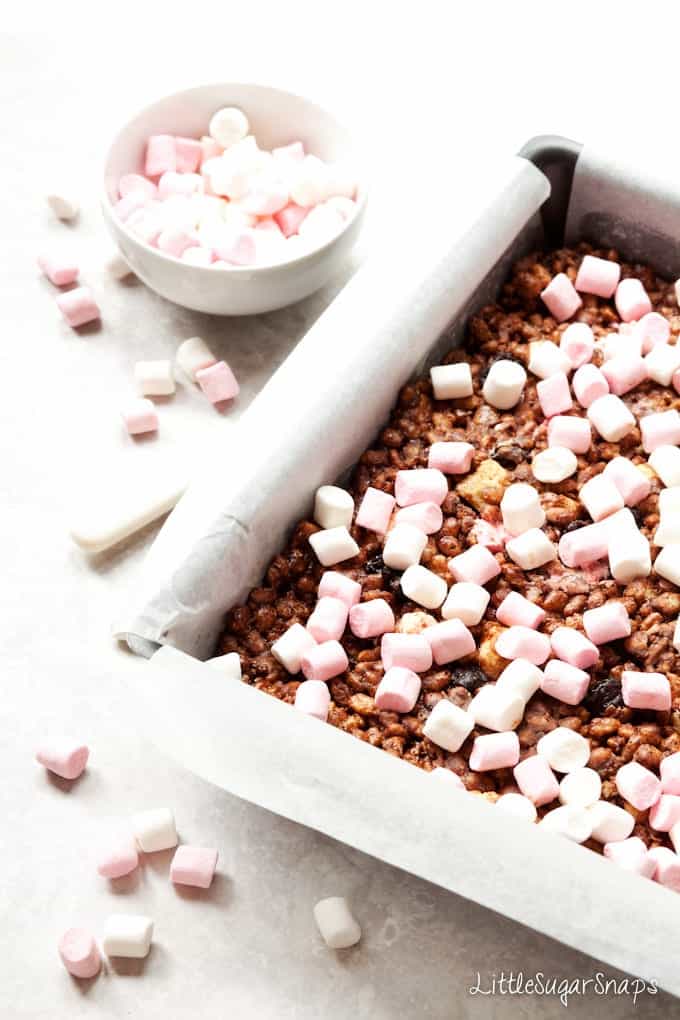 Chocolate and marshmallow no bake squares in a baking tin