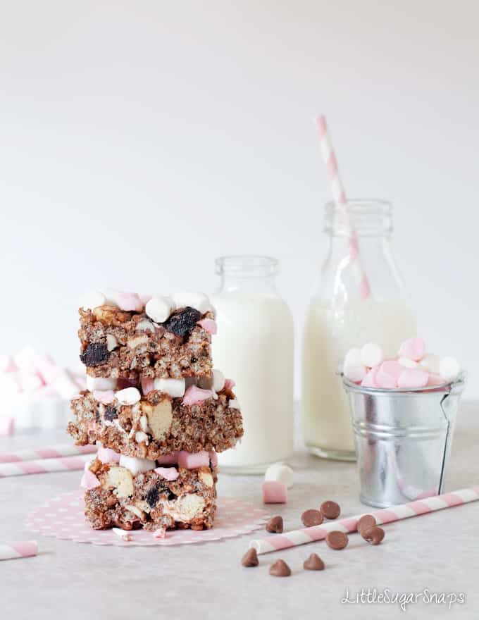 A stack of Rocky Road Rice Krispie Treats with milk