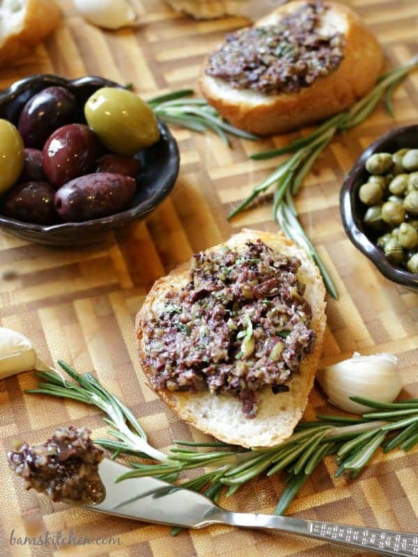 Rosemary and garlic infused olive tapenade on toasted baguette