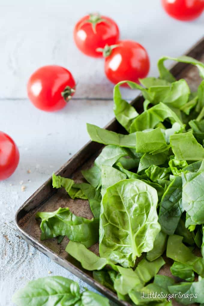 chopped raw spinach on a vintage tin tray