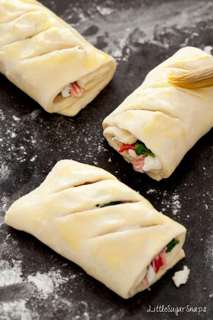 uncooked savoury rolls on a worktop