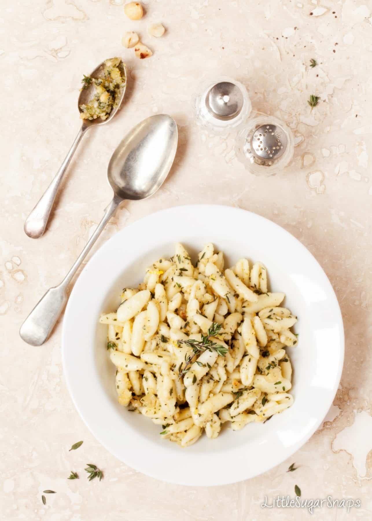 Pasta served with hazelnut pesto stirred through.