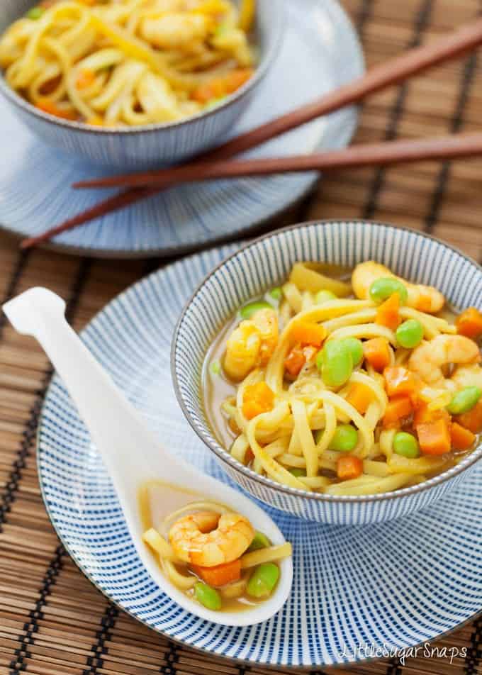 Japanese Curry soup with noodles, prawns, edamames and carrots