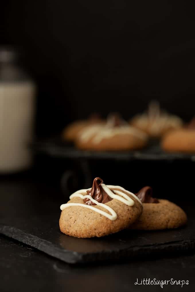 Nutella thumbprint cookies drizzled with white chocolate