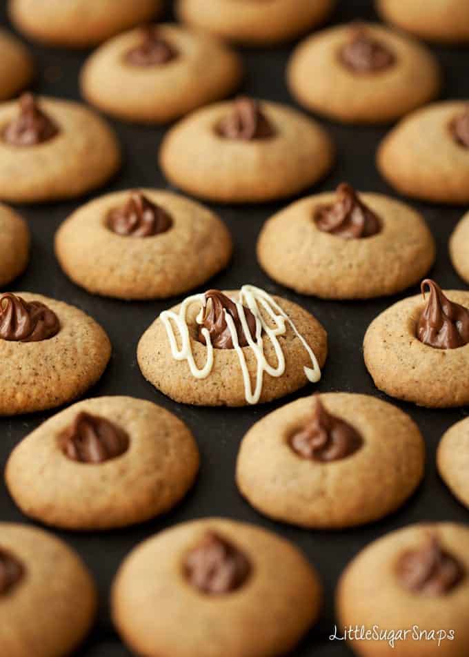 Nutella thumbprint cookies - one is topped with white chocolate