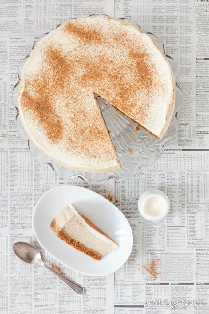 Cheesecake topped with ground spice with a slice cut out