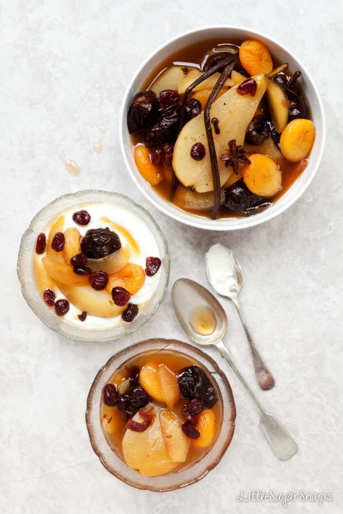Bowls of Spiced Fruit Compote with yoghurt.
