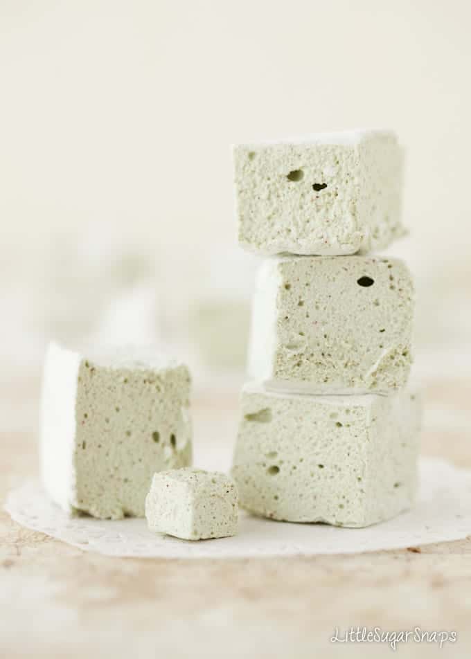 A stack of apple and cinnamon marshmallow chunks on a fancy doily