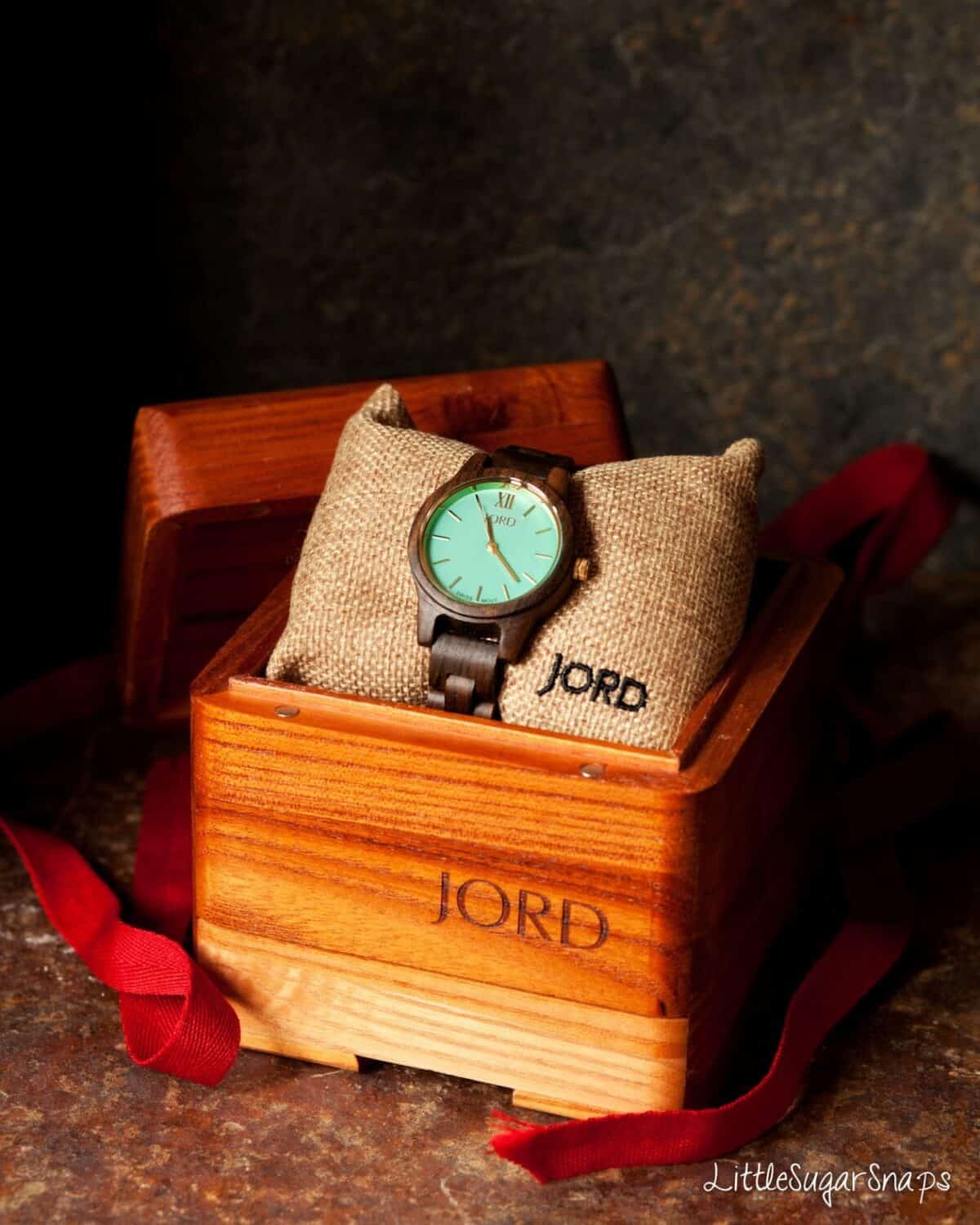 A wooden watch in a presentation box.