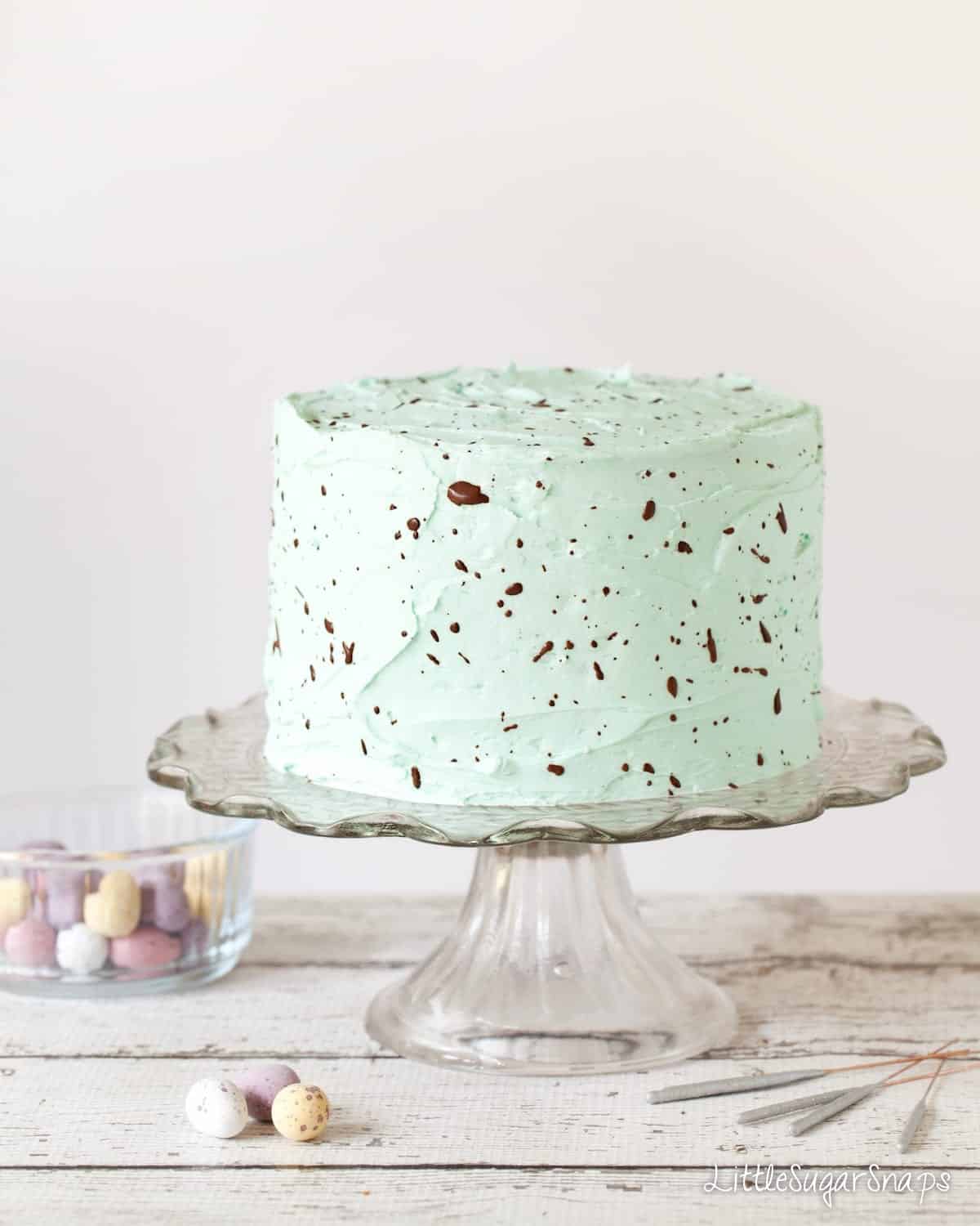 Easter cake recipe decorated to look like a speckled egg.

