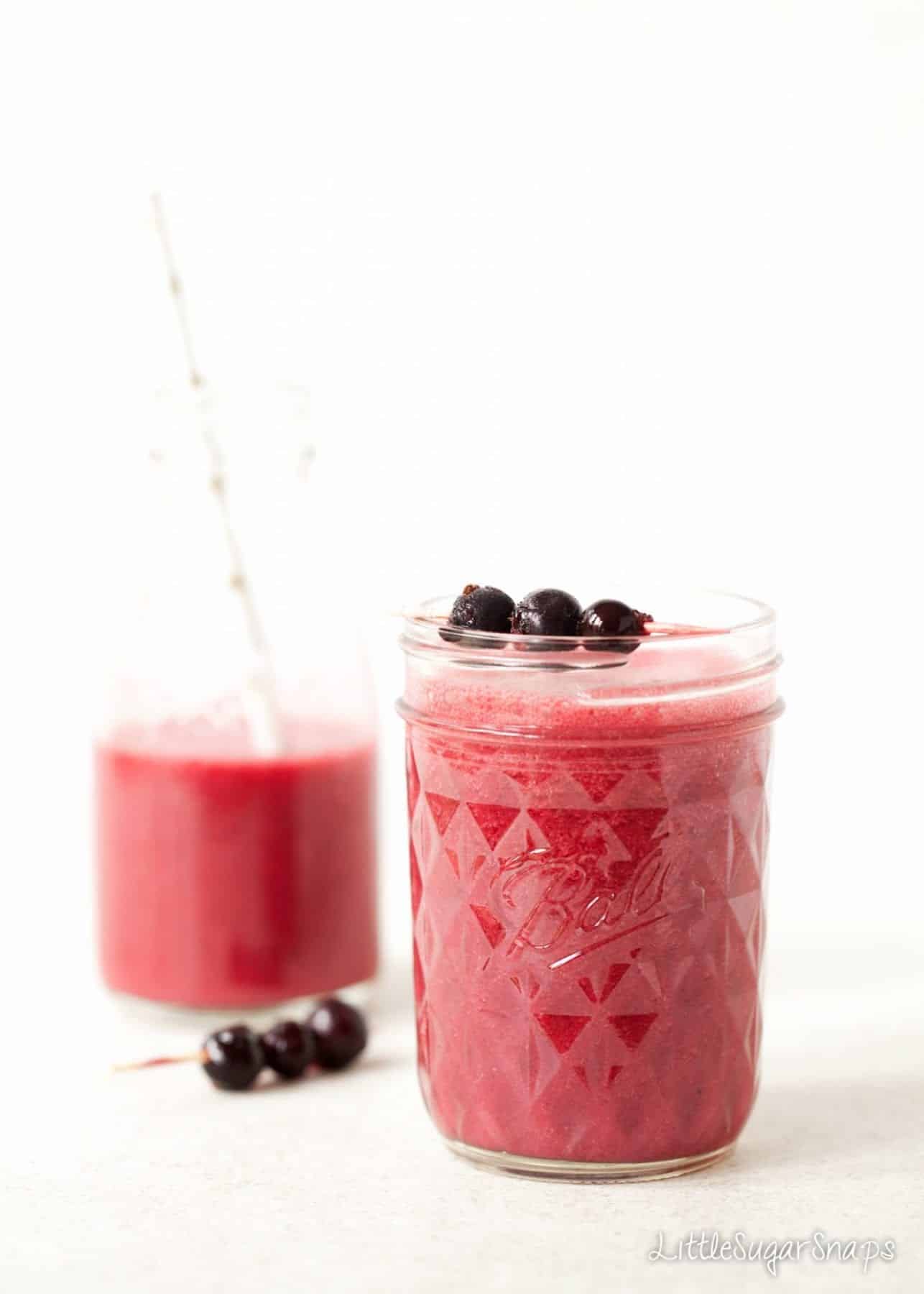 Coconut Blackcurrant Smoothie topped with blackcurrants