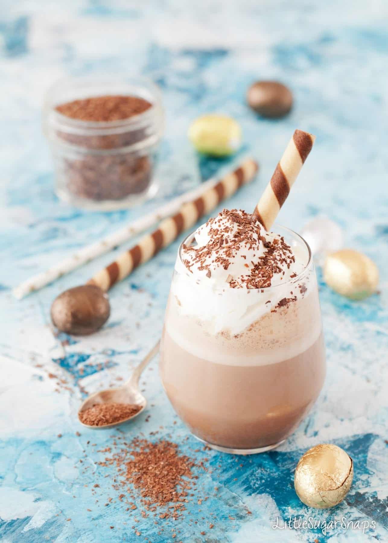 A Chocolate Milkshake topped with whipped cream and chocolate flakes