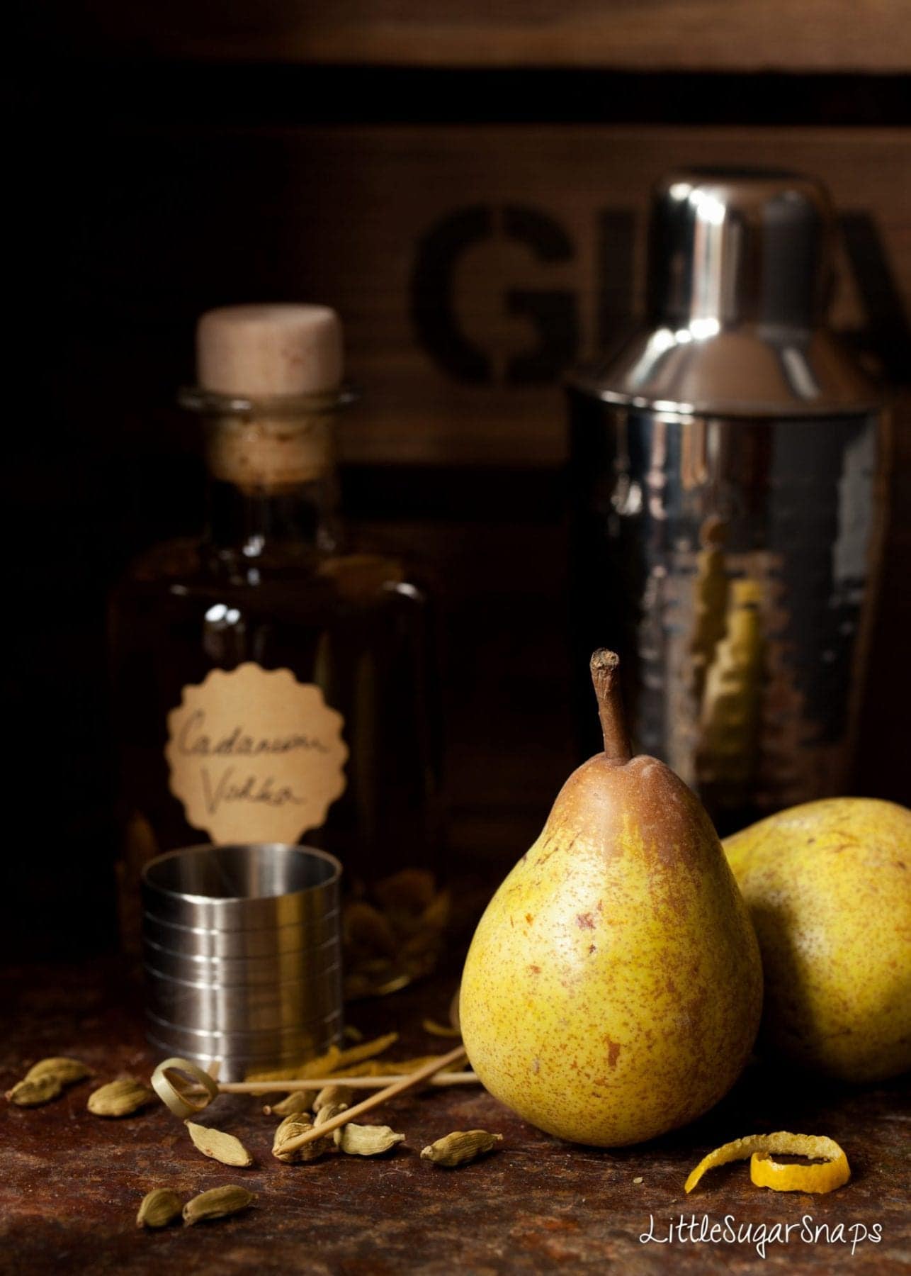 Fresh pears and a bottle of cardamom infused vodka