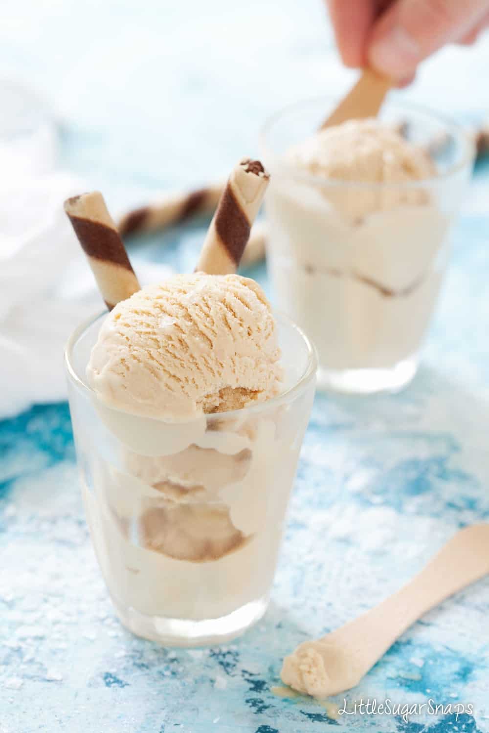 Homemade gelato in small glasses garnished with chocolate wafers