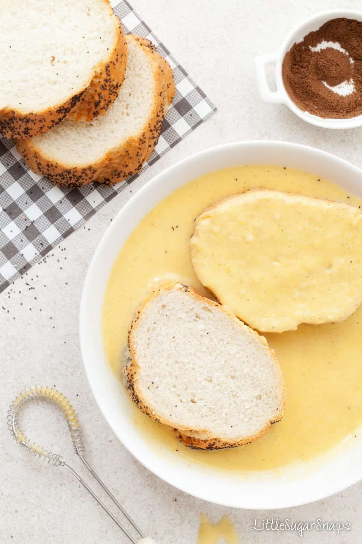 Dipping bread into Vegan French Toast batter