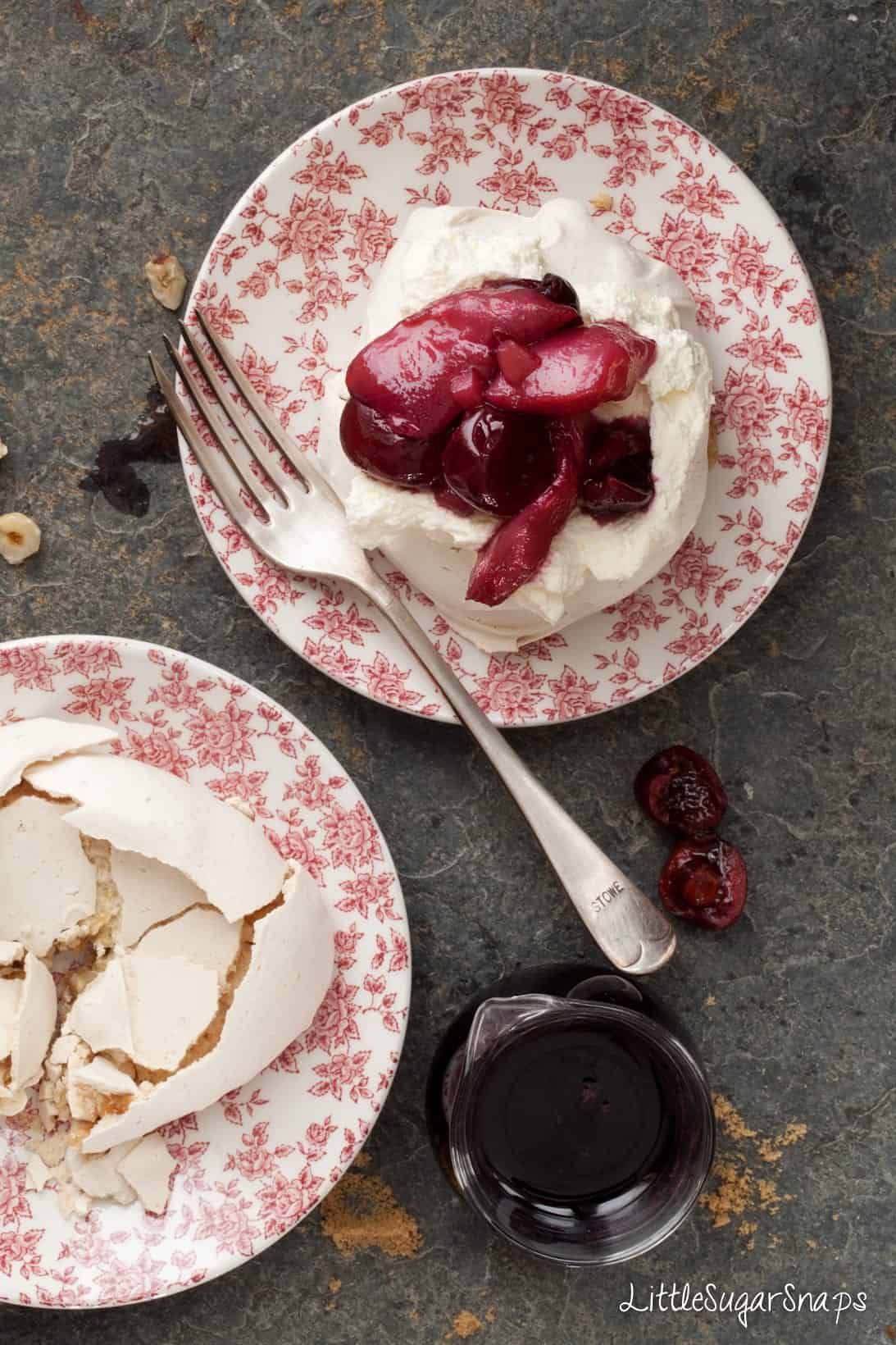 overhead of mini pavlova topped with poached fruit and cream