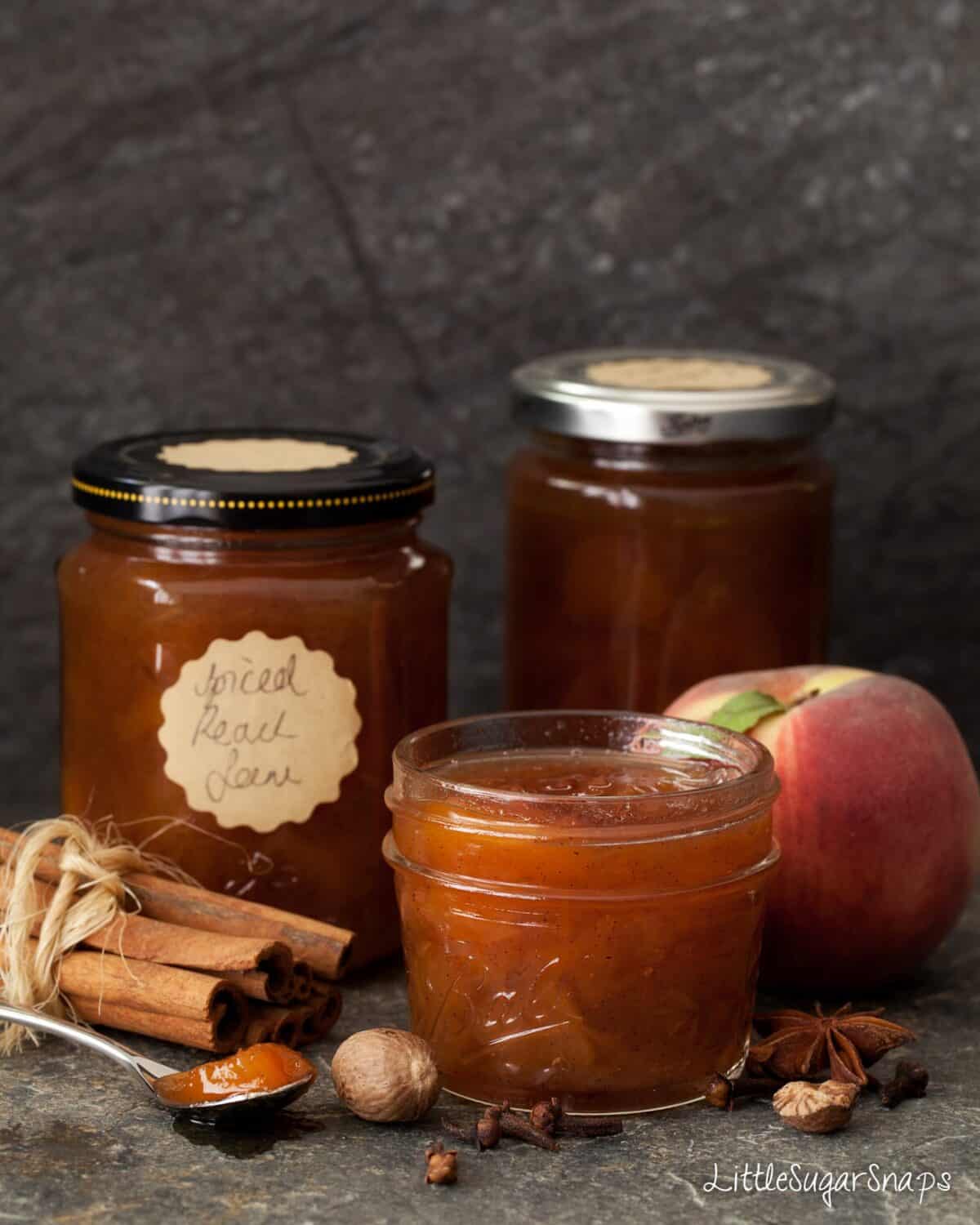 Spiced Peach Jam with ingredients alongside: peaches, cinnamon, anise, clove and nutmeg.